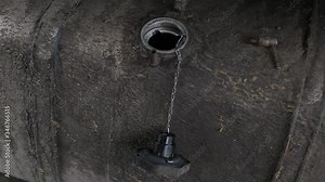 Refueling a dirty road train with diesel fuel. Road reagents. Fuel consumption on the highway, industry, autotruck