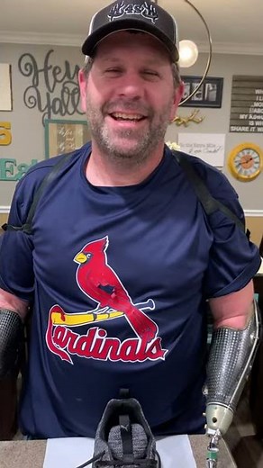 Bilateral arm amputee tying shoes with body powered hooks