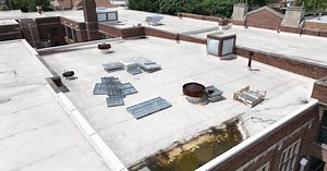 Worker dead, another injured after falling through roof of Detroit school