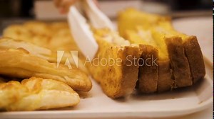 Displaying of sandwiches and bread in the window display, someone choosing sandwich.
