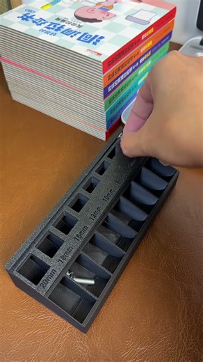 This is a 3D-printed M3 bolt and screw sorter tray.