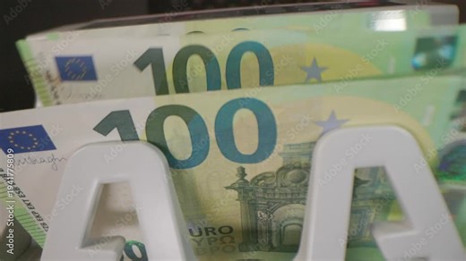 100 Euro banknotes beeing counted in the counting machine.