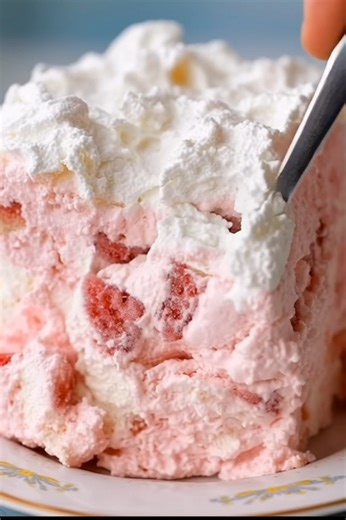 this Strawberry Angel Food Dessert is the perfect no-bake treat! 🍓☁️ Cubes of airy angel food cake are suspended in a creamy, dreamy strawberry-gelatin base, all topped with a cloud of whipped cream. It's an easy, refreshing, and absolutely delicious dessert for any occasion! #StrawberryDessert #AngelFoodCake #NoBakeDessert #StrawberryShortcake #EasyDessert #SummerDessert #CreamCheeseDessert #WhippedCream #SweetTreats #QuickDessert #HomemadeDessert #FamilyFavorite #PartyDessert #DeliciousRecipe