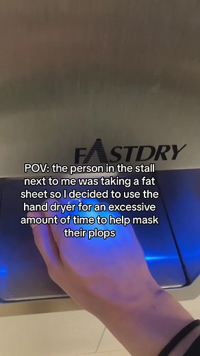 Helpful Hand Dryer in the Bathroom Stall