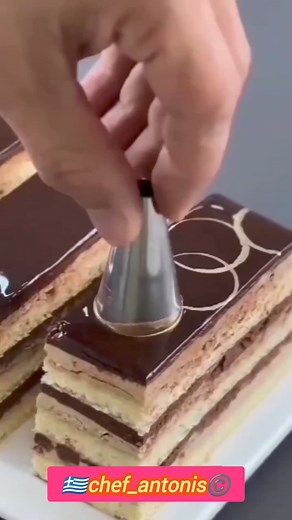Opera Cake Almond sponge cake 3 eggs 75g powdered sugar 75g almond flour Egg white 4 50g sugar 3ml Lemon juice 80g cake flour Pan Size 17x11 Bake on a preheated oven 180 degrees 10min After the cake is cooled, use a 29*10cm mold to carve 3 pieces. Coffee Cream 130g butter 1 part espresso coffee vanilla extract 5 egg yolk 40g sugar 75ml of warm milk 20g of sugar Spread a small amount of raspberry jam on the second slice of cake Syrup 100g of water 100g sugar vanilla extract 10ml orange juice Choc