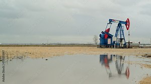Pumpjack Oil Pump operating on natural gas in the oil field
