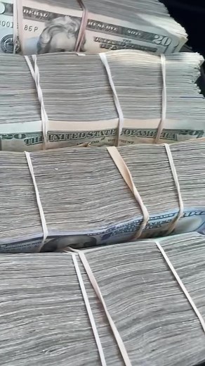 Counting US Currency: $50 and $20 Bill Stack