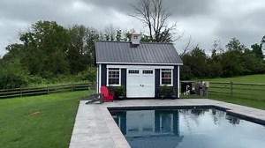 2021 has been a Summer of Poolhouses! Last year we met more people than ever looking to reimagine what their backyards can be, and now we’re so excited to see some of their results! This 12 x 18 New England Barn with Deep Ocean Lap Siding is the perfect centerpiece for our customers brand new inground pool. #backyarddesign #backyardoasis | Lapp Structures