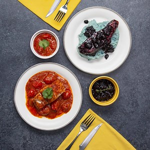 In honor of Dr. Seuss Day we made not one, but two, fish dishes. First, pieces of flaky cod fish and fresh grape tomatoes are nestled in a red curry sauce, then a blueberry-glazed salmon is plated up with whimsical blue potatoes for a Dr. Seuss-inspired dinner! | Tasty