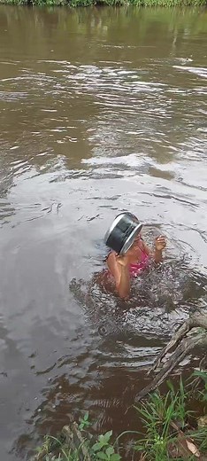 Young Girl Enjoys Nature and Swimming in a Lush Forest