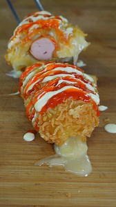 48M views · 439K reactions | They're not the classic corn dogs... watch Foodqood to believe it and start cooking! INGREDIENTS 5 pieces tomino cheese 1 sausage Flour Egg Crushed spaghetti Fry oil Spicy sauce Mayonnaise | Giallozafferano Loves Italy | Facebook