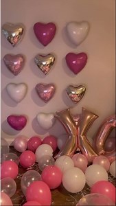 Create an easy DIY heart balloon wall that makes the perfect backdrop for all your Valentine's Day photos! Click through to shop our selection of Valentine's Day balloons 💖🎈 | Party City