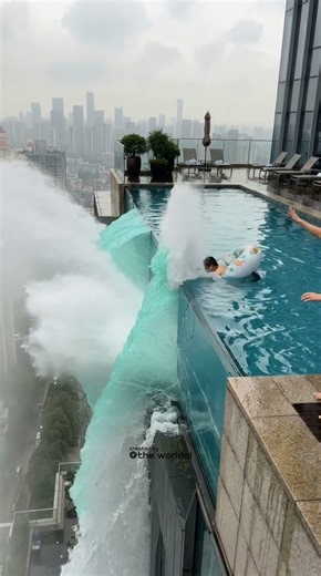 A rooftop pool gets a hole… and water starts pouring from the 50th floor 💦