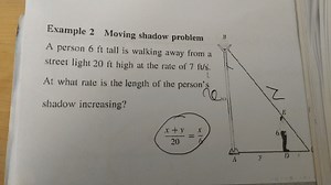 Example 2 Moving shadow problem A person 6 ft tall is walking a... | Filo