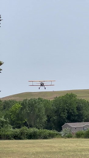 Stearman biplane landing on grass. #aviation #stearmanbiplane