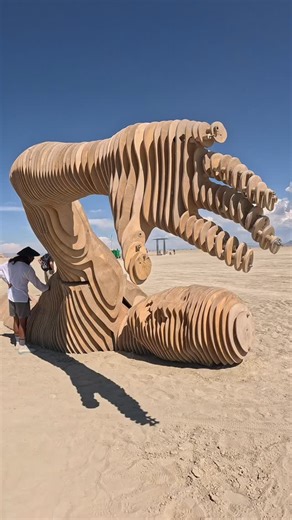 Burning Man Official Live Webcast on Instagram: "Merman Merman is a large-scale wooden sculpture of a mythical sea creature, blending human and aquatic forms. Originally selected as a Burning Man 2021 Honorarium project, its debut was postponed due to COVID cancellations. Exhibited in Kyiv in the meantime, Merman now prepares for its long-awaited journey to Black Rock City — a tribute to resilience, transformation, and our connection to nature. A wonderful example of art touching aspects of the 