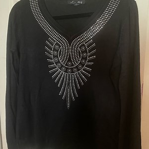 A beautiful woman’s sweater very light