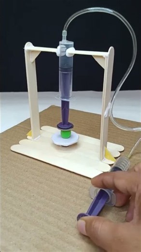 Mini Hydraulic Press Experiment Using Syringes and Craft Sticks in