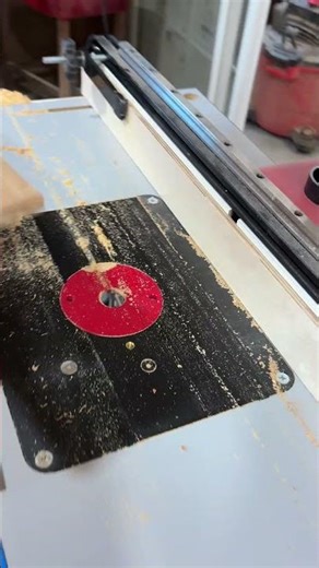 Using a digital router table to make a five cuts automatically spaced in a board.