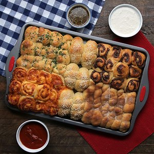 1.1M views · 2.8K reactions | Stuff it, roll it, twist it, tie it! The possibilities are truly endless with pizza dough  Recipe: https://tasty.co/recipe/5-piece-pizza-party | Tasty | Facebook