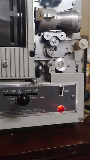 1970s film projector connected to modern amplifier(with original speaker)