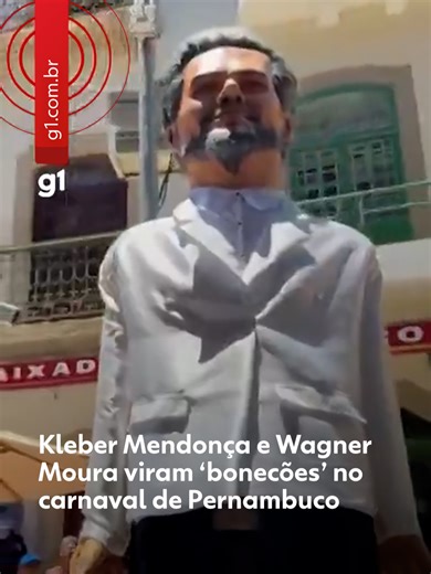 #Carnavalnog1 - Conhecido pela criatividade, o carnaval de Pernambuco conta com a participação de celebridades e personagens ficcionais. A presença dessas personalidades é garantida não só na fantasia dos foliões, mas nos tradicionais desfiles de bonecos gigantes que enfeitam a festa todos os anos. Entre os nomes que desfilam em 2026, estão ícones da cultura pop mundial como Lady Gaga, Ozzy Osbourne e Bruno Mars. Também serão homenageados o ator Wagner Moura e o diretor Kleber Mendonça Filho, qu