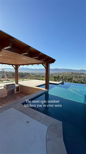 When we say “epic,” we mean it. This sunken outdoor kitchen isn’t just a place to cook, it’s an experience. Built right next to an infinity pool with a view that takes your breath away, it’s everything you could dream of for entertaining or relaxing in style. If you could design your ultimate backyard, what would you include? 🌅🍴💦 | Majestic Pool Construction