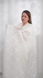 122K views · 6.8K reactions | The white organza saree epitomizes elegance with its sheer fabric and intricate detailing. This classy attire exudes ethereal charm, gracefully draping the wearer in a timeless allure. Its subtle transparency and delicate texture make it a symbol of refined sophistication and enduring beauty. | Drape Divaa | Facebook