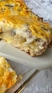 We love this easy breakfast casserole made with biscuits, sausage, gravy, eggs, and cheese. It is perfect for the weekend or the upcoming holidays. #breakfastcasserolewitheggs | In Jamie's Kitchen