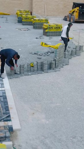 Concrete Block Laying Techniques at Construction Site