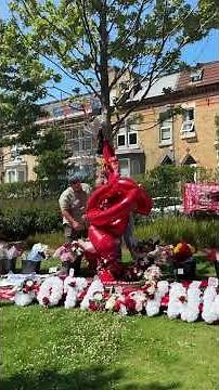 '20' balloons among the tributes at Anfield Stadium
