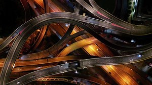 Drone shot rotating view the car move at highway interchange at Damansara