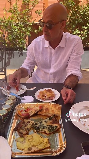Stanley Tucci Enjoying Delicious Pizza in Rome