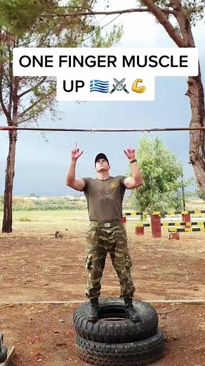 Greek Soldier Demonstrates Impressive Middle Finger Muscle Up