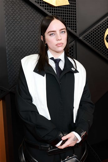 Billie Eilish, nominated for Record of the Year and Song of the Year, strikes a pose at the #GRAMMYs.