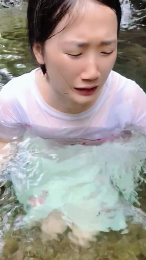 Girl Swimming Fully Clothed in River