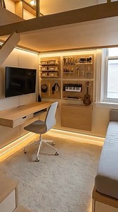 Big function in a tiny footprint ✨ We transformed a cramped micro-studio into a calm Japandi space with a loft bed, stair-drawers, a clean under-loft workspace, a daybed with storage, and a modular hobby wall (plus a fold-down craft table that disappears when you’re done). The warm LED strips under the stairs, under the loft, and along the floor reveal make everything feel “floating” and premium. Which feature would you want most in your own place—stair-drawers, fold-down hobby table, or the und