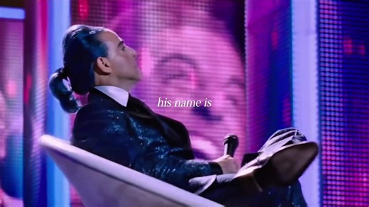 Unveiling Caesar Flickerman: The Iconic Host of the Hunger Games