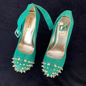 Spiked heels, one small spot (can be viewed in video)