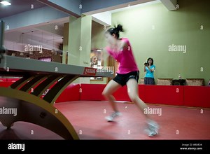 American table tennis player Ariel Hsing, front, practices as her mother Jiang Xin Hua uses a portable video camera to record during a training sessio Stock Photo - Alamy