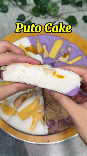 Puto Cake is a soft and fluffy Filipino steamed cake made lighter with meringue and gently folded batter. It has a delicate crumb and a mildly sweet taste, making it perfect for snacks, celebrations, or merienda. This recipe uses cake flour, baking powder, sugar, water, egg whites, vinegar, and ube food flavor. The sugar is strained for a finer texture, while the whipped egg whites help create a light and airy cake when steamed. Steamed slowly and topped with salted egg and cheese, puto cake is 