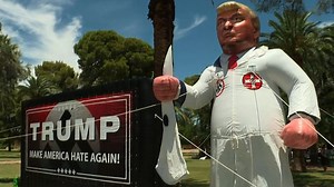 Inflatable of Donald Trump in KKK robe pops up at rally