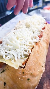 Easy lasagna recipe made in a loaf of bread Rae and Jake find a new way to make homemade lasagna, fresh and extra cheesy, with more of a crunch. Rae was able to boil her lasagna noodles until they reached al dente, and from there added olive oil, onion, yellow pepper, tomato sauce, tomato paste, ground beef, and seasoning. As this cooked, she sliced a large whole in the middle of a sourdough loaf, and coated it with olive oil, parsley, basil, and garlic. Yum. Then, she added ricotta cheese, the 