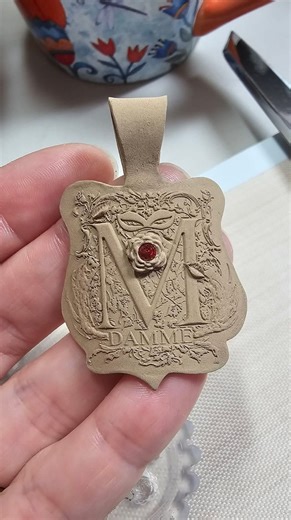 Gorgeous monogram pendant using our custom brass plate stamp. Here are few words from the artist behind this piece. I am retired and a self taught jeweler. I metal smith, silversmith, wire work, bead weave and now my latest passion is working with metal clay. I do a lot of graphic design as well and I have had two projects where I have used Metal Clays’ products to get a very polished look to the piece. This specific pendant came from a collaboration between my sister in law Kate Mairose and mys