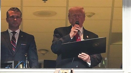Donald Trump cheered and booed as first sitting US president at regular-season NFL game since 1978