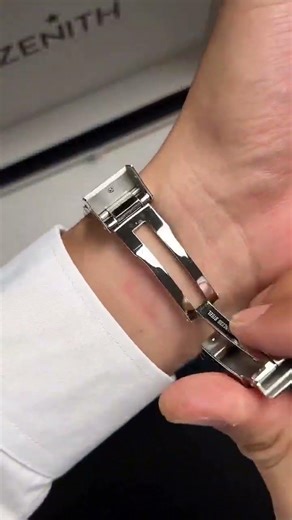 Zenith Chronomaster Sport with a black dial and integrated steel bracelet identified by model number