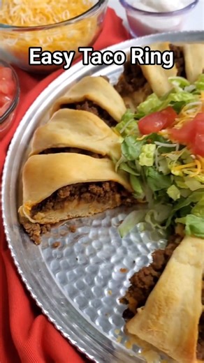 This easy Taco Ring made with crescent rolls, seasoned ground beef, and your favorite taco toppings is a fun, family-friendly dinner idea. Perfect for a quick weeknight meal or switching up Taco Tuesday! #TacoRing #EasyDinner #TacoTuesday #easydinnerideas #bestfoodfeed #mexicaninspired #weeknightmeals #weeknightdinner #easyrecipes #partyfoodideas | Everyday Shortcuts by Alison McFadden