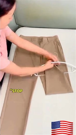“American Pants Hanger Fold Hack That Saves Closet Space and Keeps Pants Wrinkle-Free”