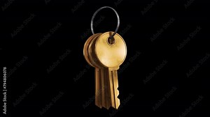 Golden Metal Keys. 3D animation of a bunch of three keys swinging on a ring. Looped video with alpha channel.
