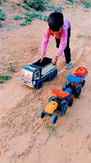 GIANT TRACTOR JUMPING INTO THE AIR WHILE PULLING A TRUCK